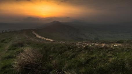 Serene Sunset Over Rolling Hills wallpaper