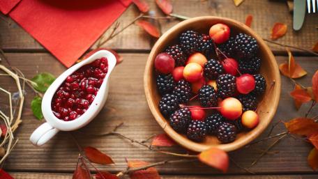 Fresh Berry Harvest on Rustic Wood Planks wallpaper