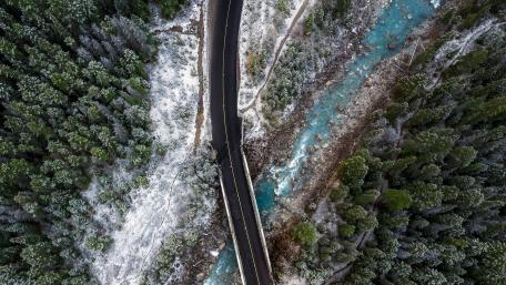 Frozen Serenity Over a River and Roadway wallpaper
