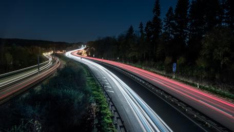 Dynamic Light Trails on a Speedway at Night wallpaper