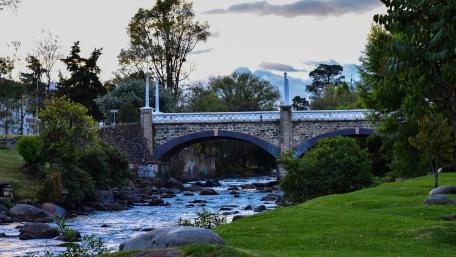 Tranquil Bridge Over Serene Stream wallpaper