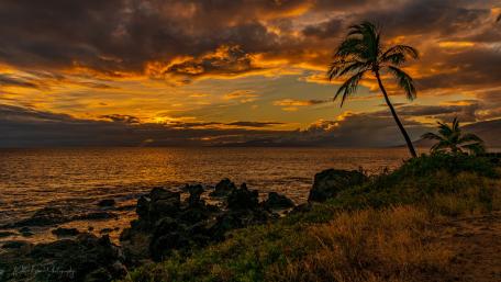 Serene Sunset Over Tropical Coastline wallpaper