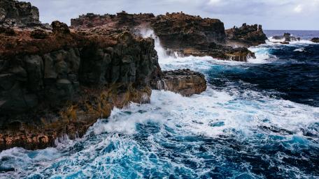 Majestic Cliffs Overlooking Wild Waves wallpaper