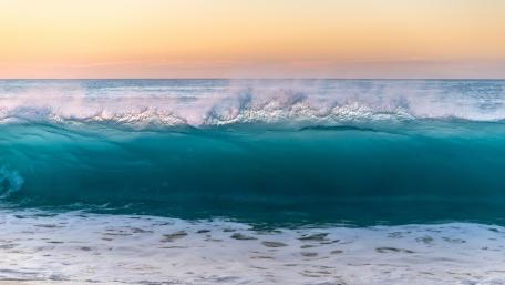 Majestic Ocean Wave at Sunset wallpaper