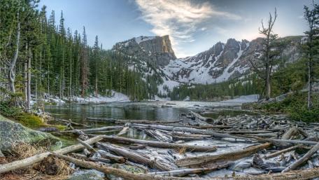 Serene Mountain Lake Surrounded by Majestic Pines wallpaper