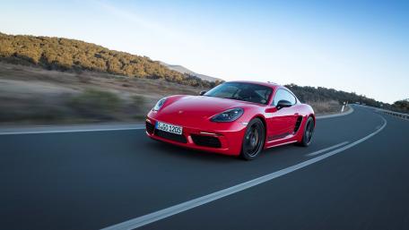Striking Red Porsche in Motion wallpaper