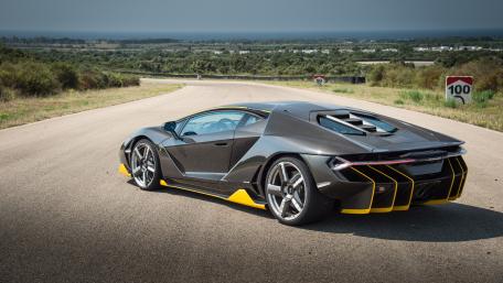 Sleek Modern Supercar in Scenic Landscapes wallpaper