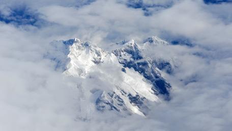 Majestic Peaks in the Clouds wallpaper