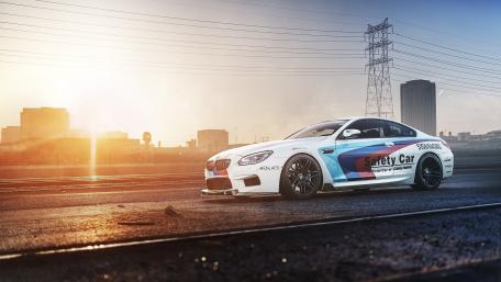 Dynamic Racing Scene with Safety Car wallpaper