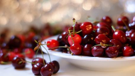 Vibrant Cherries on a Plate wallpaper