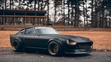 Classic Datsun 240Z in a Rainy Setting wallpaper