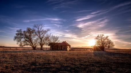 Serene Cottage at Sunset in Nature's Embrace wallpaper