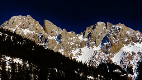 Majestic Snow-Capped Peaks Under a Starry Sky wallpaper