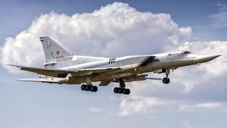 Soviet Bomber in Action Above the Clouds wallpaper