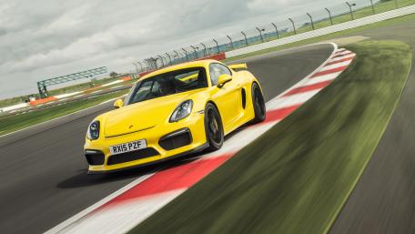 Fast Yellow Sports Car on the Race Track wallpaper