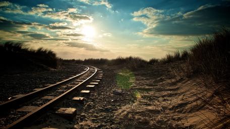 Curved Rails Under a Beautiful Sky wallpaper