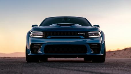 Sleek Blue Muscle Car at Sunset wallpaper