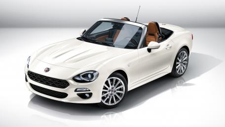 Sleek White Convertible for Stylish Adventures wallpaper