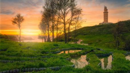 Serene Sunset Over Towering Landscape wallpaper