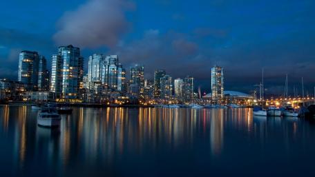 City Lights Reflected in Water at Night wallpaper