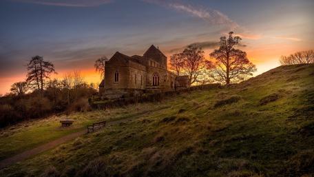 Serene Sunset Over a Tranquil Landscape wallpaper