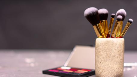 Elegant Makeup Brushes in a Chic Holder for Beauty Lovers wallpaper