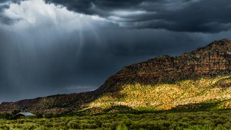 Dramatic Stormy Landscape Under Cloudy Sky wallpaper
