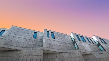 Modern Architectural Beauty Against a Colorful Sky wallpaper