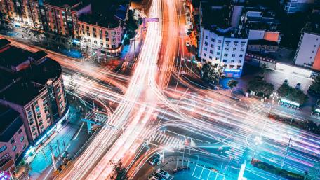 Vibrant City Lights and Dynamic Traffic Trails wallpaper