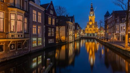 Serene Night Reflections in a City Canal wallpaper