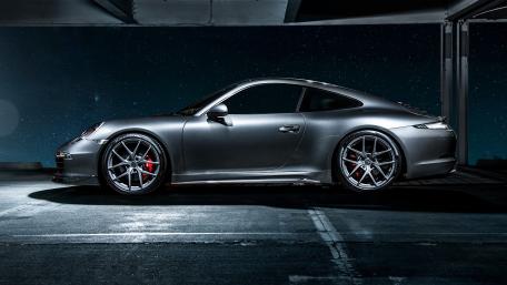 Sleek Porsche 911 in Urban Nightscape wallpaper