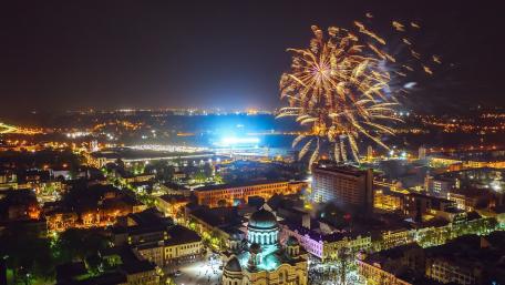 Vibrant Night Cityscape with Fireworks Show wallpaper