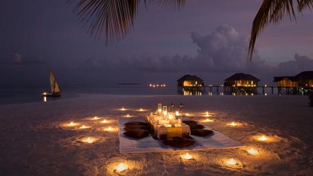 Intimate Beachside Dinner Under Moonlight wallpaper
