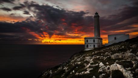 Serene Lighthouse at Sunset Glow wallpaper