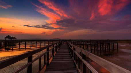 Tranquil Sunset Over Serene Boardwalk wallpaper