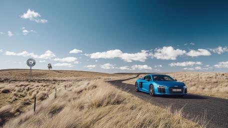 Audi R8 on an Open Road under Bright Blue Skies wallpaper