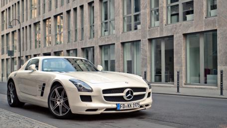 Sleek Luxury Mercedes SLS AMG in Urban Setting wallpaper
