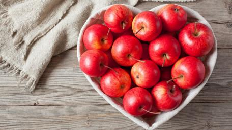 Heartfelt Harvest of Red Apples wallpaper