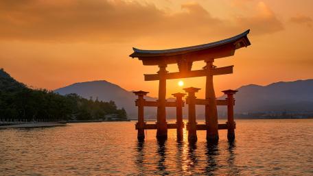 Serene Sunset at a Torii Gate Over Water wallpaper