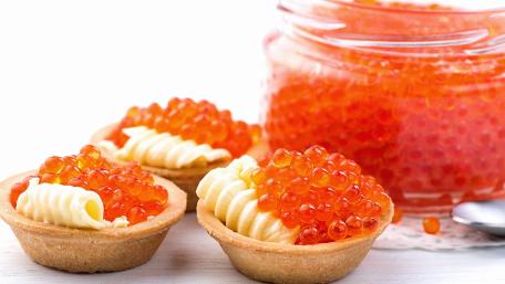 Delicious Tartlets with Vibrant Caviar and Creamy Toppings wallpaper