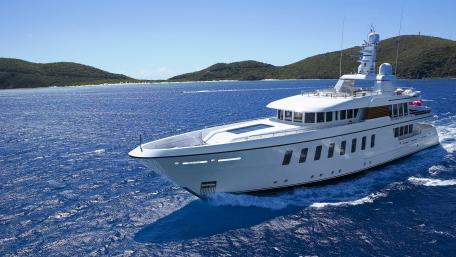 Luxury Yacht Sailing Through Crystal Clear Waters wallpaper