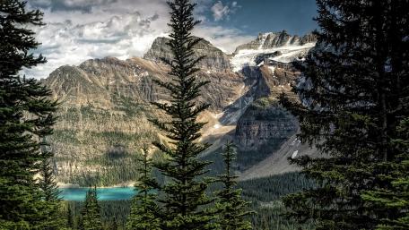 Majestic Mountain Landscape with Tranquil Lake Views wallpaper