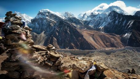 Majestic Mountain View with Rocks and Prayer Flags wallpaper