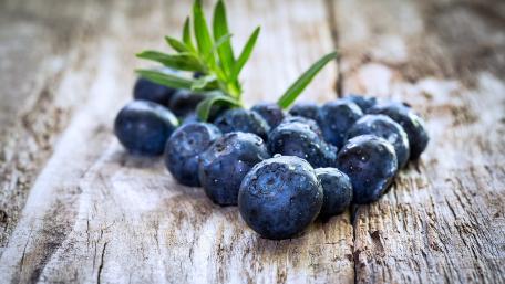 Fresh Blueberries on Rustic Wooden Table wallpaper