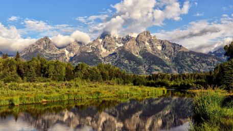 Majestic Mountains Reflected in a Serene River wallpaper