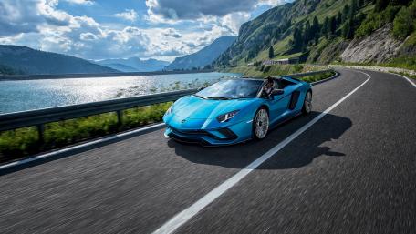 Stunning Blue Sports Car on Scenic Road wallpaper