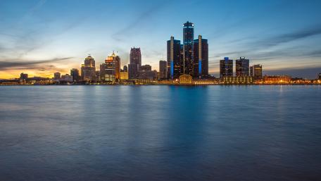 City Skyline at Dusk Over Water wallpaper