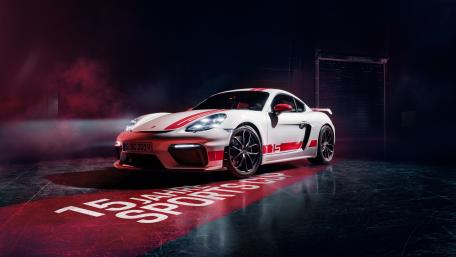 Sleek Sports Car in Dramatic Lighting Scene wallpaper