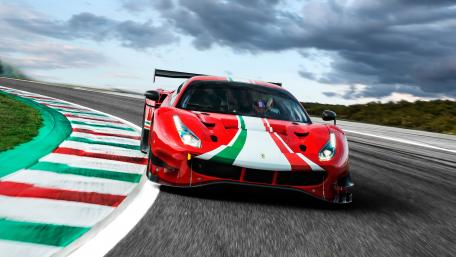 Dynamic Race Car in Action on Track wallpaper
