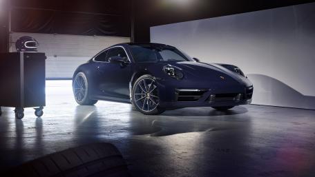 Sleek Porsche 911 in a Modern Studio Setting wallpaper
